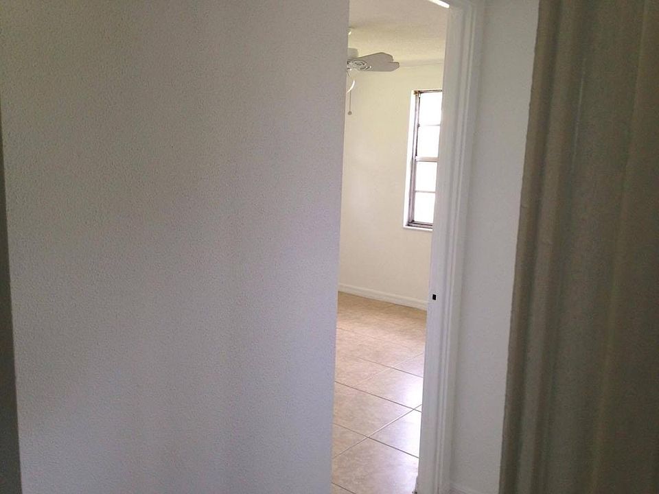 view into one of 3 bedrooms