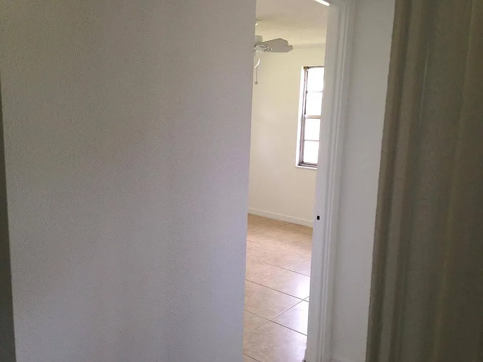 view into one of 3 bedrooms