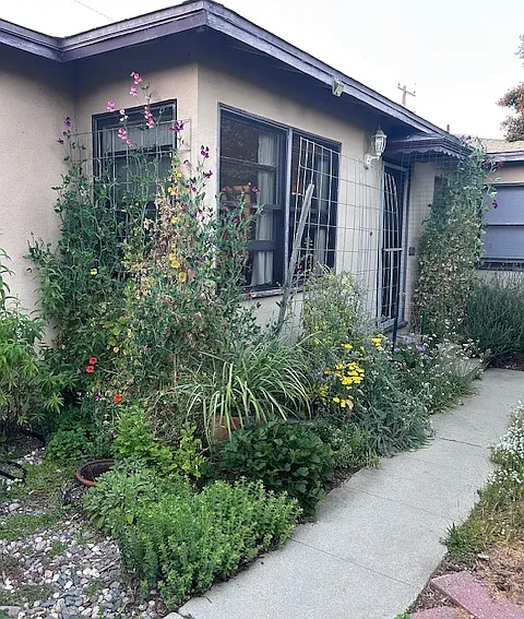 Front door of the unit. This garden area was planted by previous tenant and is now just dirt waiting for the next tenant to reimagine it!