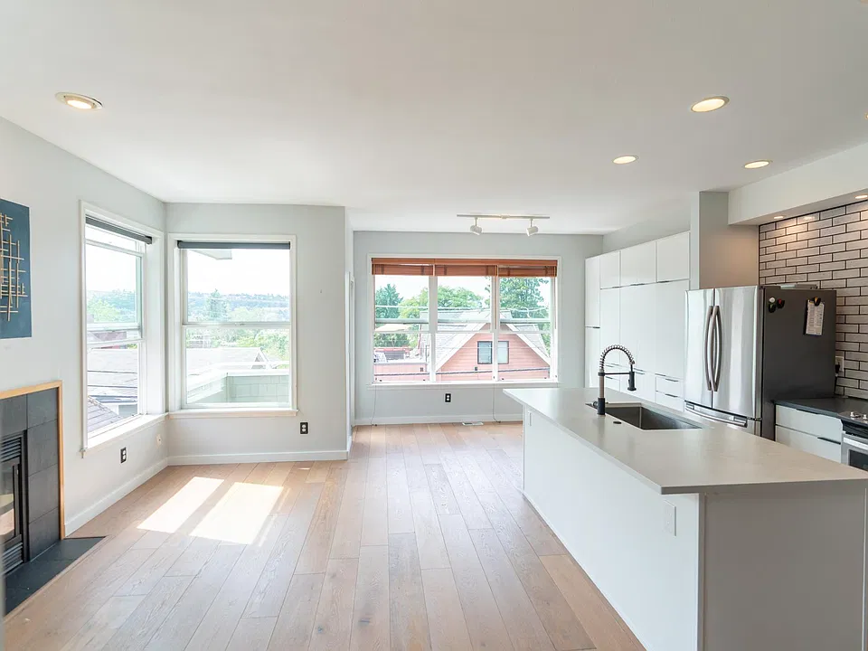 Open concept kitchen and living room, filled with natural light
