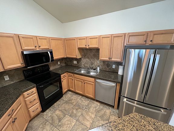 Kitchen with brand news appliances.