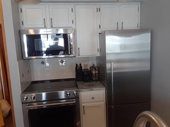 Kitchenaid Professional Microwave, Range & Fisher & Paykel 13.5 cuft refrigerator with bottom freezer