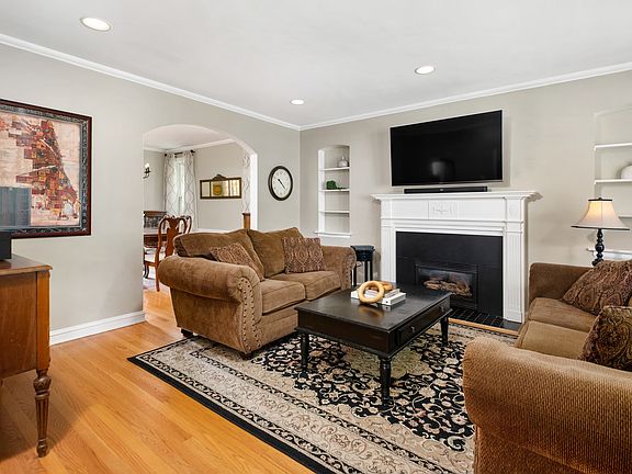 Living Room with Wood Burning Fireplace & Gas Star
