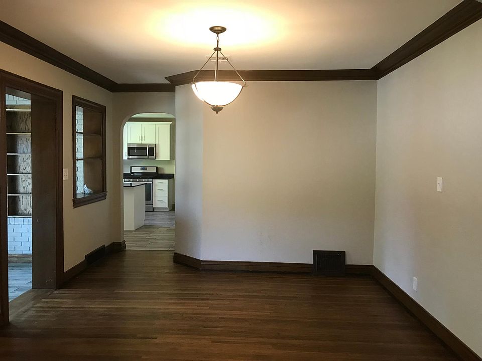 Large dining room with original crown and base trim. 