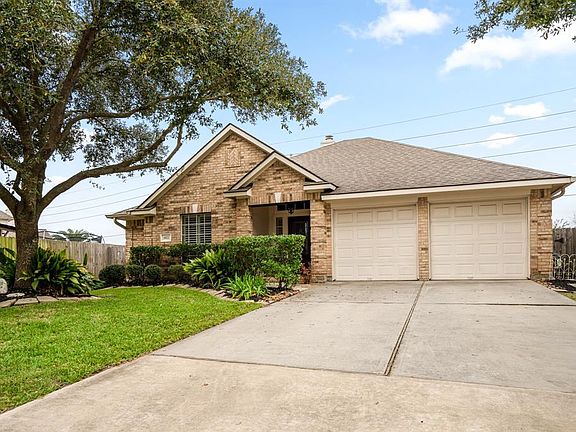 JUST LOOK AT THAT LUSH LANDSCAPING! This home has been kept in PRISTINE condition.