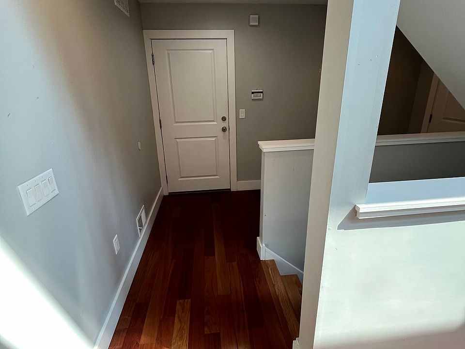 Entry level -- stairs up to kitchen/living room and down to unfinished basement. Door straight ahead provides indoor access to private one-car garage.