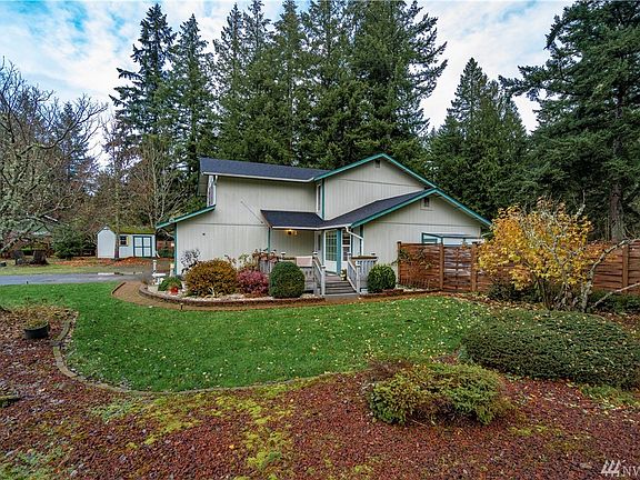 Partially covered front deck with a great deal of space for patio furniture.