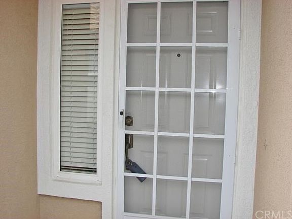 FRONT ENTRY TAKES YOU INTO A TILED FOYER WITH VIEWS OF THE GREAT ROOM.