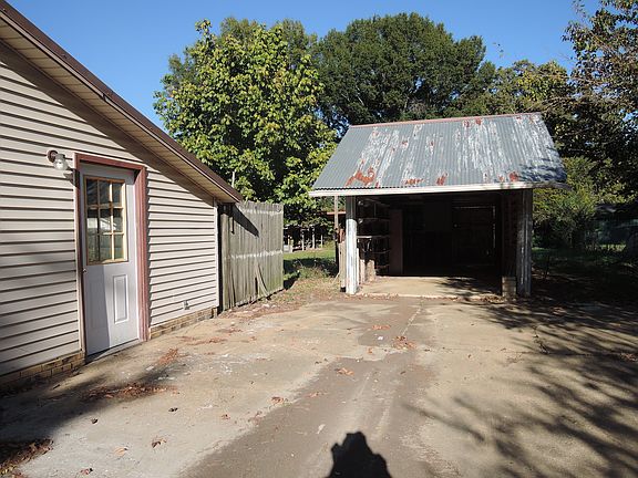 The end of the driveway, meets wit a small shed great for storage