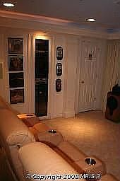 Home theater with built in equipment cabinet