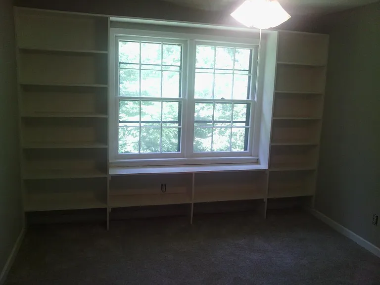 Bedroom with bookshelves