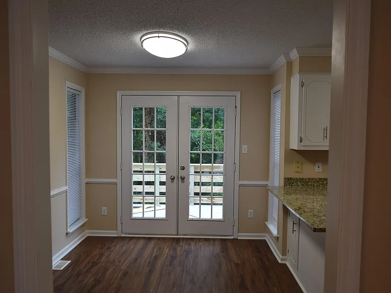 Enter the front door to the foyer, standing right there looking straight ahead is a view to the kitchen through to the french doors directly to the walk out deck and back yard