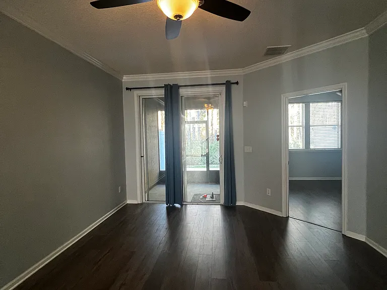 Living room overlooking screened in porch.