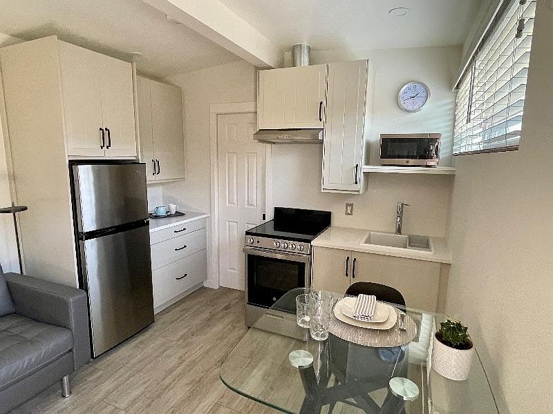 Everything you need and nothing you don't! The main living space is thoughtfully designed, stylish and comfortable. Cook up a storm on your 24" glass-top range (or take the night off from cooking and use the microwave). Kitchen features under-cabinet ligh
