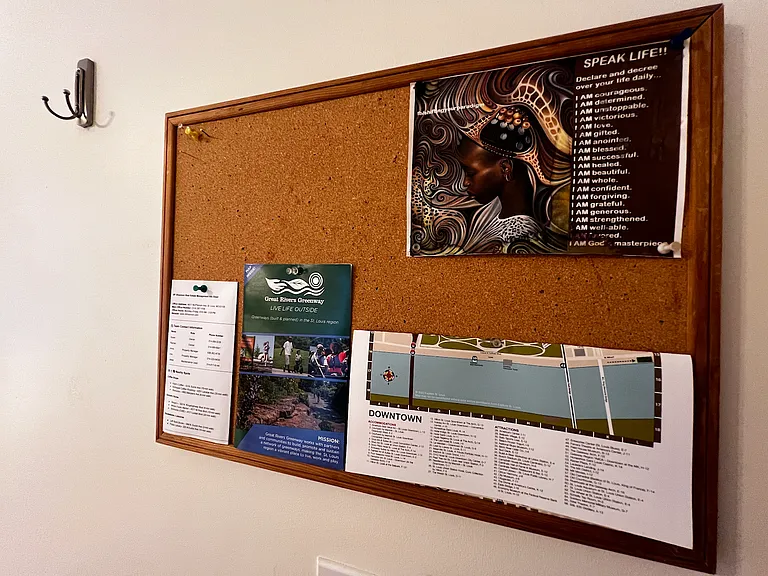 Bulletin board and hanging hooks.