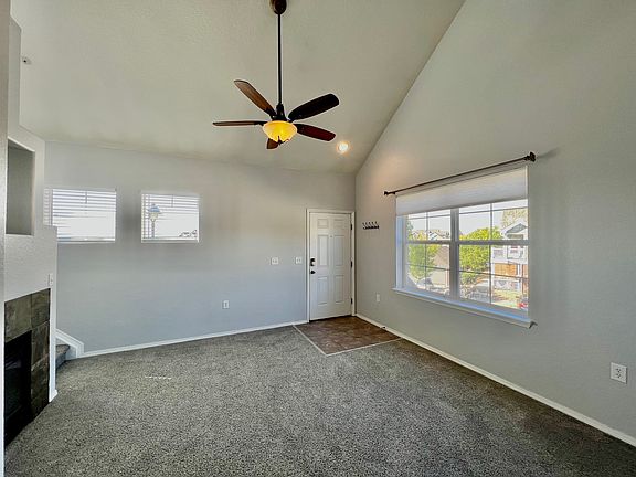 Living room with large picture window, fire place, cable connection