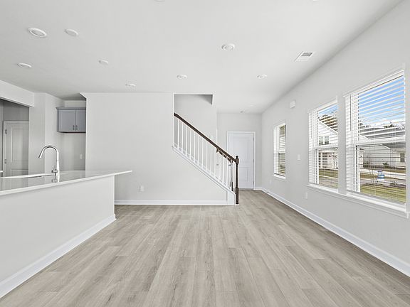 The stunning open-concept floorplan allows for easy flow between the kitchen and dining areas.