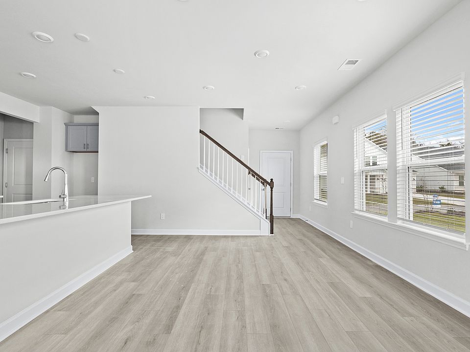 The stunning open-concept floorplan allows for easy flow between the kitchen and dining areas.