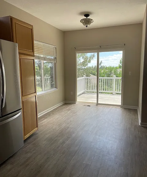 Kitchen, dining area, walk out to upper patio