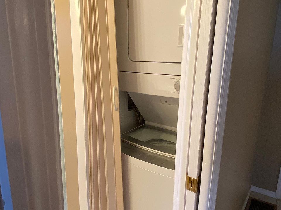 Stackable washer/dryer in bathroom.