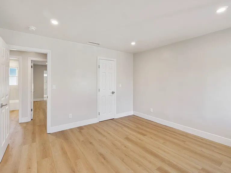 Large secondary bedroom with room for king bed and additional furniture