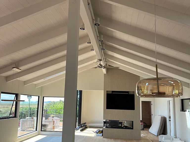 Facing view with fireplace in the middle of the two rooms