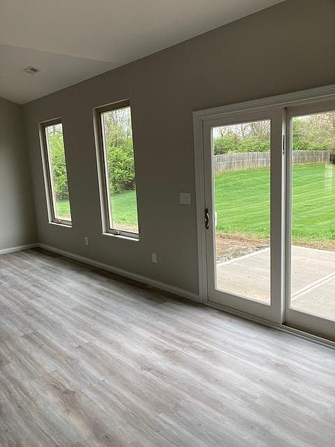 Large Windows with Screens and Blinds. Sliding Glass Door to Outdoor Patio