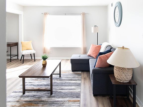 Well lit living room with 40 inch smart TV