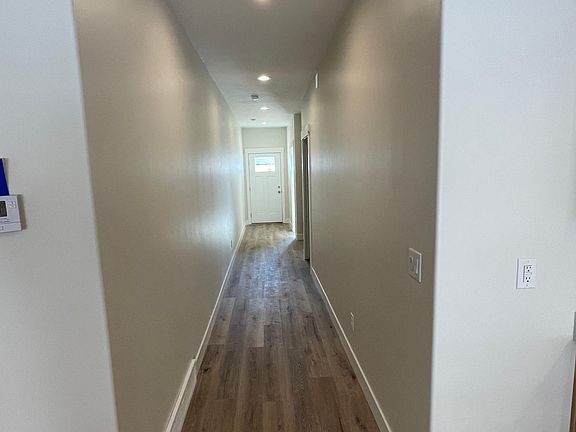 Hallway towards guest bedrooms & 
 front entry