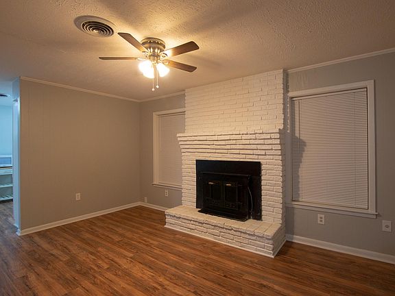 Updated flooring throughout the entire house, including this central spacious living room.