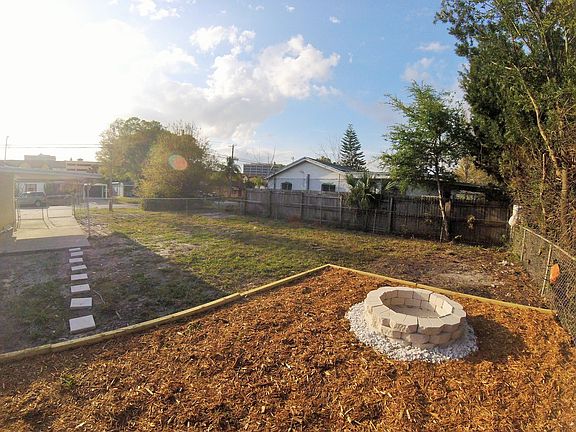 fire pit in enclosed back yard