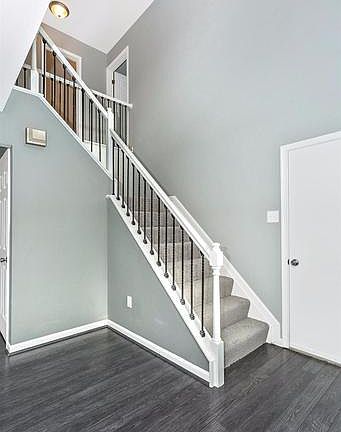 Designer laminate hardwood flooring throughout.
