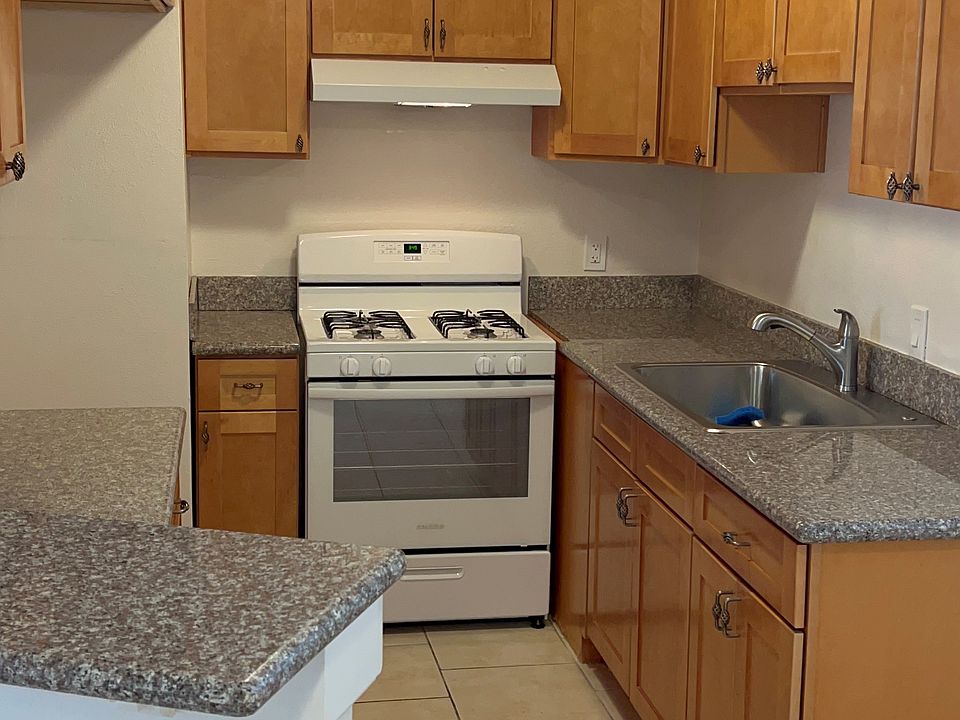 new stove; roomy kitchen with plenty of cabinetry