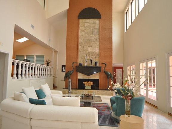 Grand living room, 24 ft ceiling, all marble floor, magnificent stone/granite wood burning fireplace