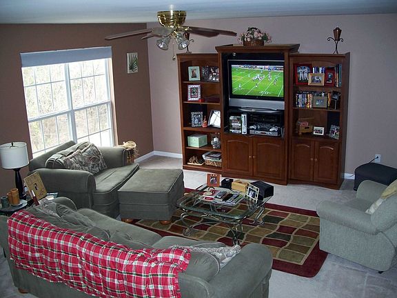 Nice open living room with lots of windows, entertainment center negotiable