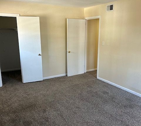 Master bedroom with walk- in closet.