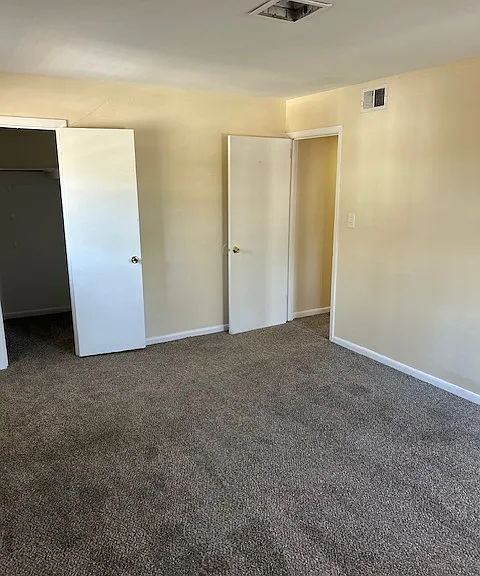 Master bedroom with walk- in closet.