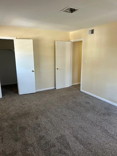 Master bedroom with walk- in closet.