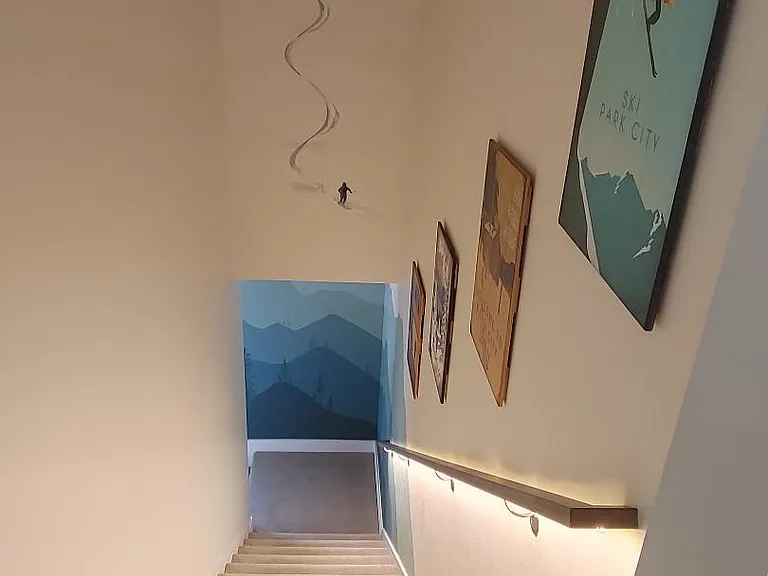 View from top of stairwell with wall murals