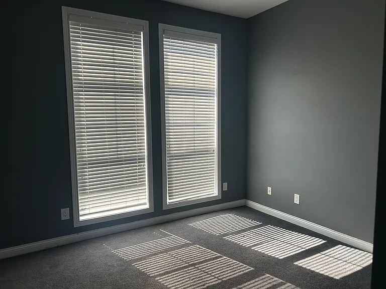 Bedroom#2 with high ceiling and wall height windows for plenty of natural lights.