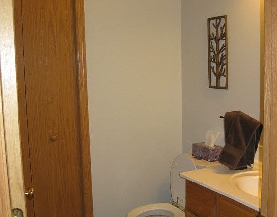 Convenient half bath located on the first floor includes a h