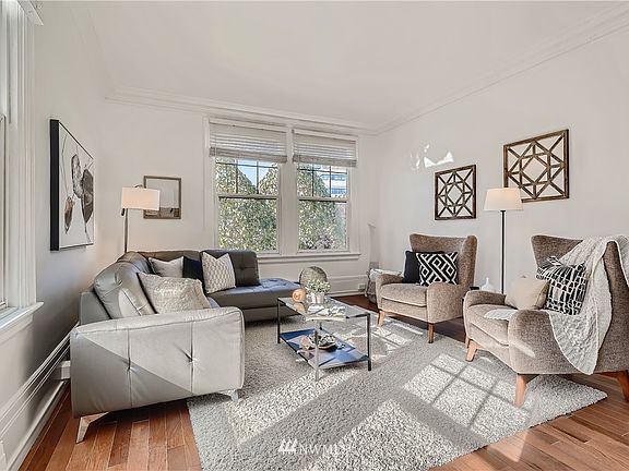 Living Room with tons of natural light with new hardwood floors!