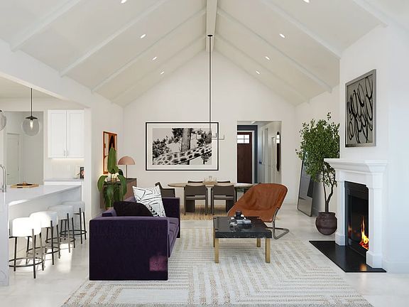 Great room with vaulted ceiling and white painted ceiling beams