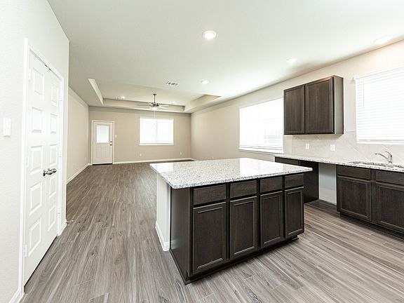 Kitchen to Dining Area and Family Room