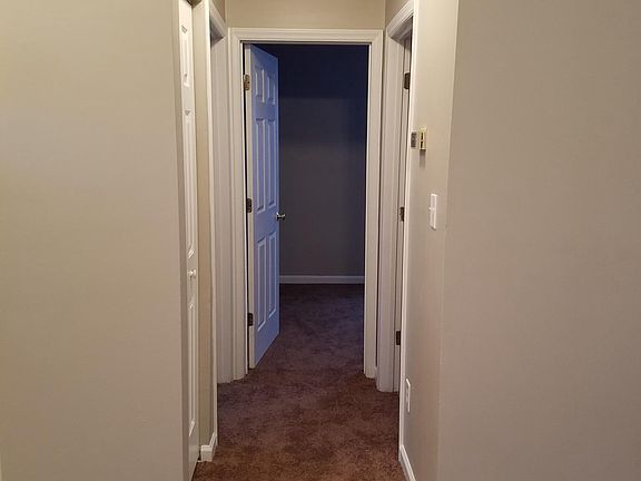 Hallway to two bedrooms & full bath