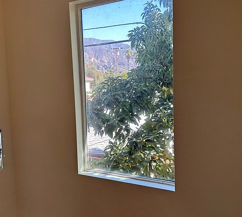 View of the mountains from the picture window in stairway