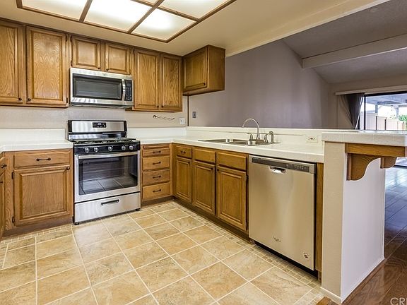 Cute kitchen with new stainless appliances