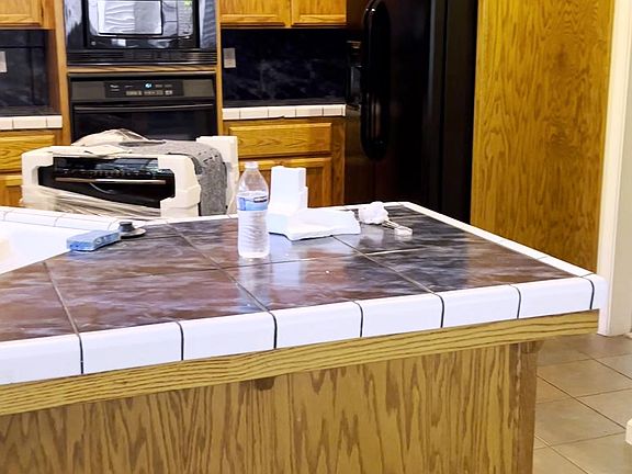 Kitchen with new dishwasher being installed