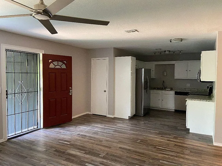 Double door entry with metal security door of this newly remodeled home.