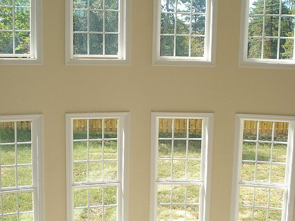 Wall of windows in family room.